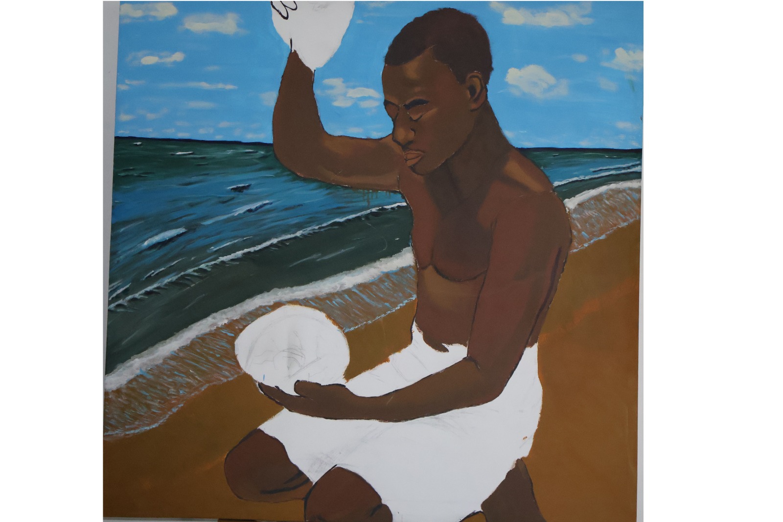 Lead from the Heart – portrait of a young African man kneeling at the shoreline